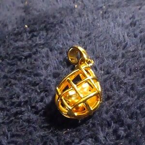 Beautiful gold cage pendant with cream and grey pearls